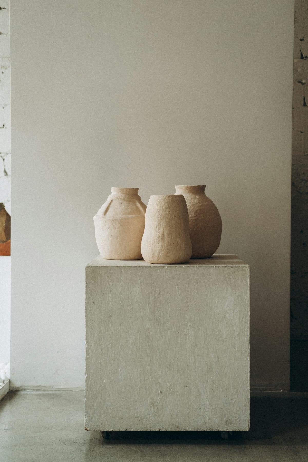 Handmade terracotta clay vases on a pedestal