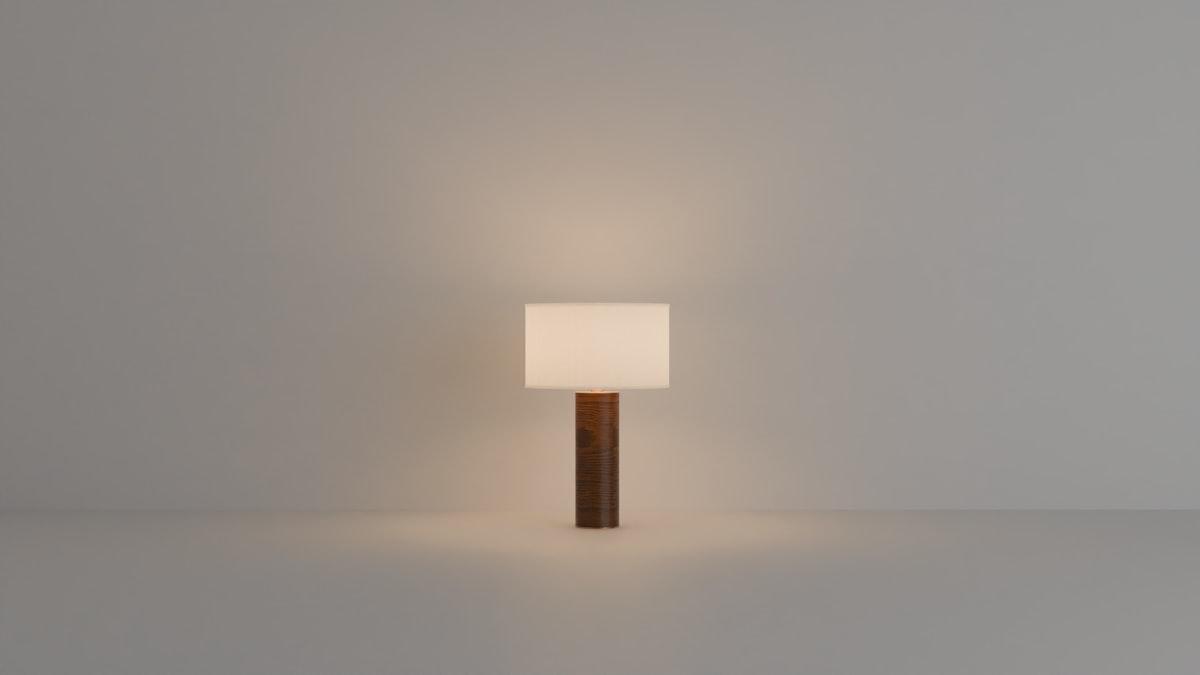 Table lamp with a wood base and a warm glow